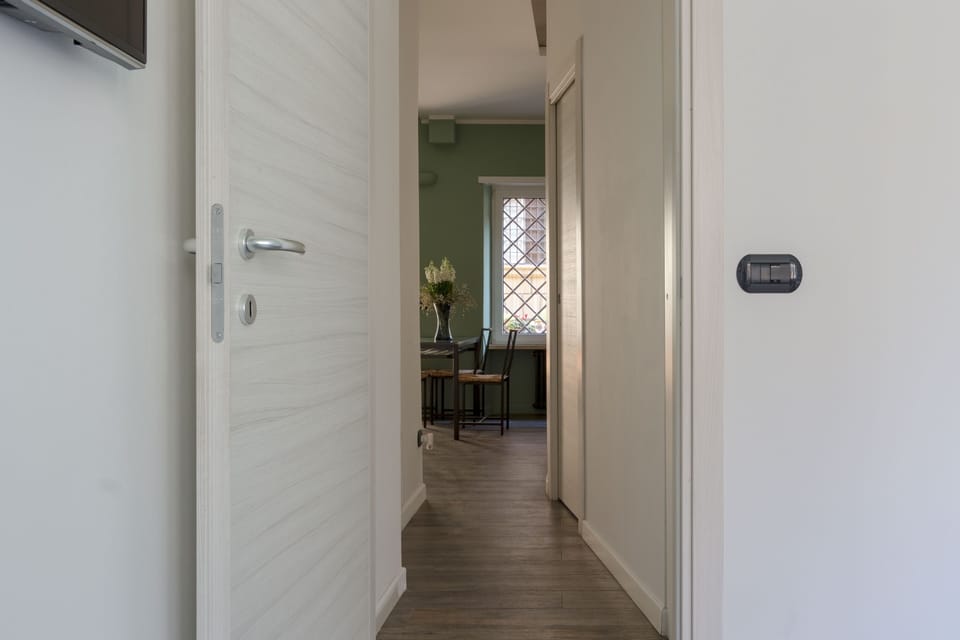 View from the bedroom of the corridor towards the living room (washing machine