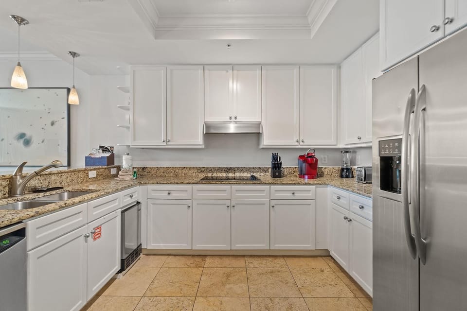 Condo, Multiple Beds (Indigo West 1202) | Private kitchen | Oven, toaster, paper towels
