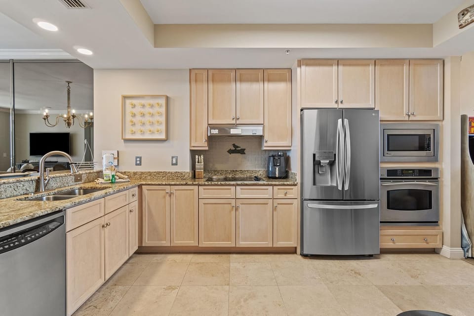 Condo, Multiple Beds (Indigo East 1004) | Private kitchen | Oven, toaster, paper towels