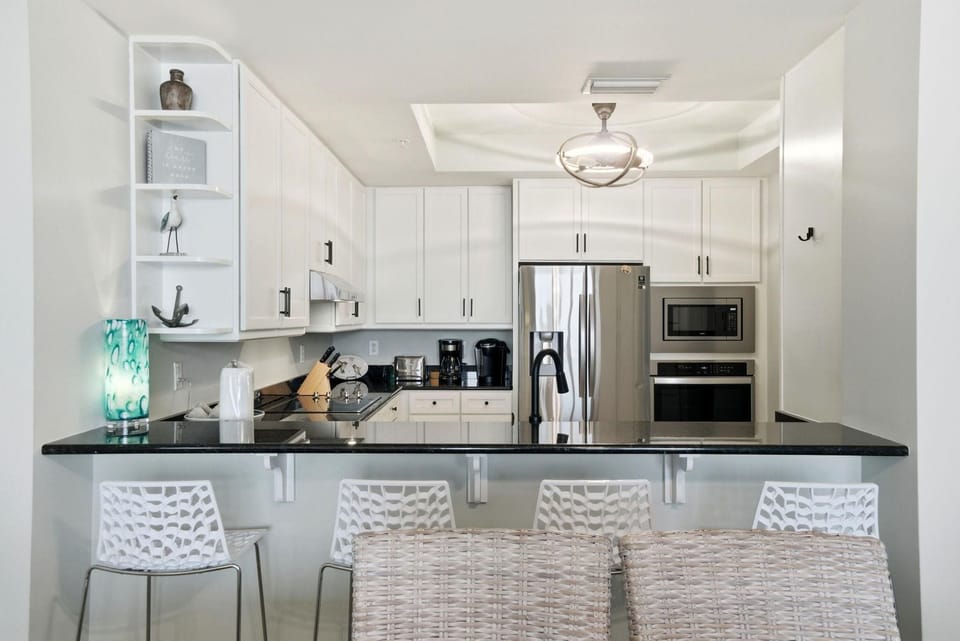 Condo, Multiple Beds (Indigo East 1802) | Private kitchen | Oven, toaster, paper towels