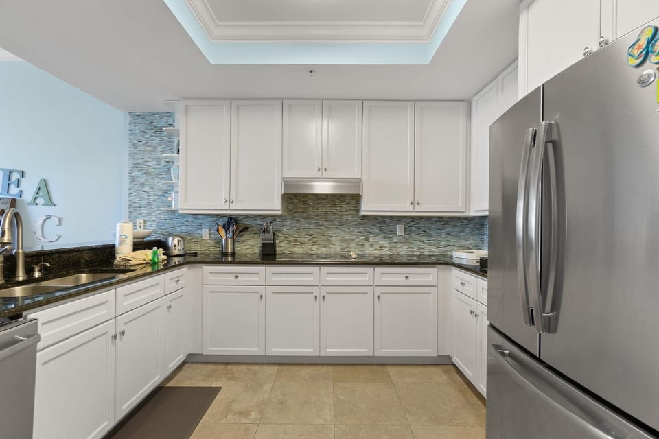 Condo, Multiple Beds (Indigo East 2002 with Private Poolsid) | Private kitchen | Oven, toaster, paper towels
