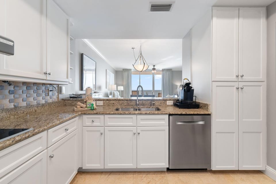 Condo, Multiple Beds (Indigo East 505) | Private kitchen | Oven, toaster, paper towels