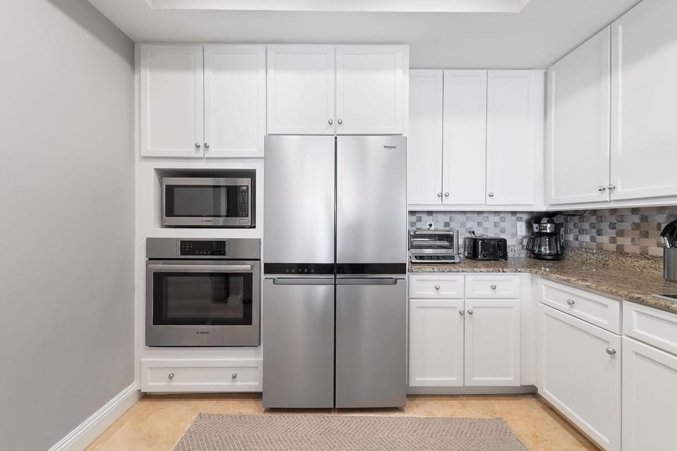 Condo, Multiple Beds (Indigo East 505) | Private kitchen | Oven, toaster, paper towels