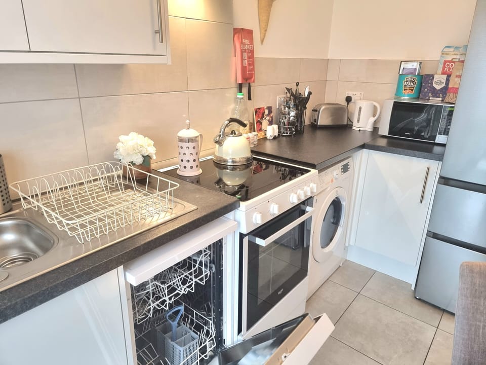 Apartment | Private kitchen | Full-size fridge, microwave, oven, stovetop