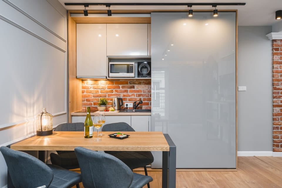8. Studio Saint Florian's Suites | Private kitchenette | Mini-fridge, microwave, stovetop, coffee/tea maker