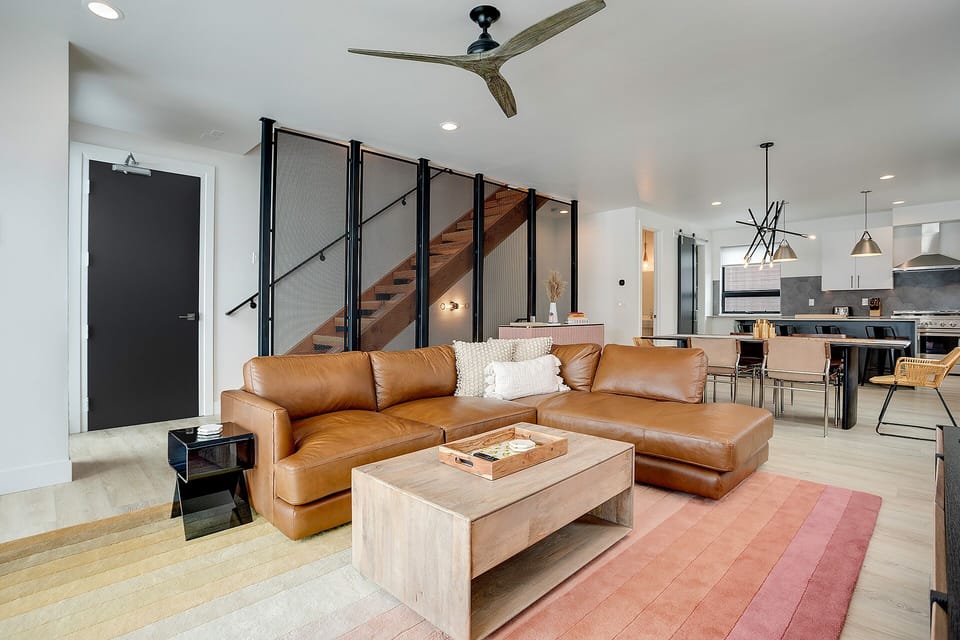 Settle into your stylish open-concept living space with luxurious leather seating and modern design touches throughout.