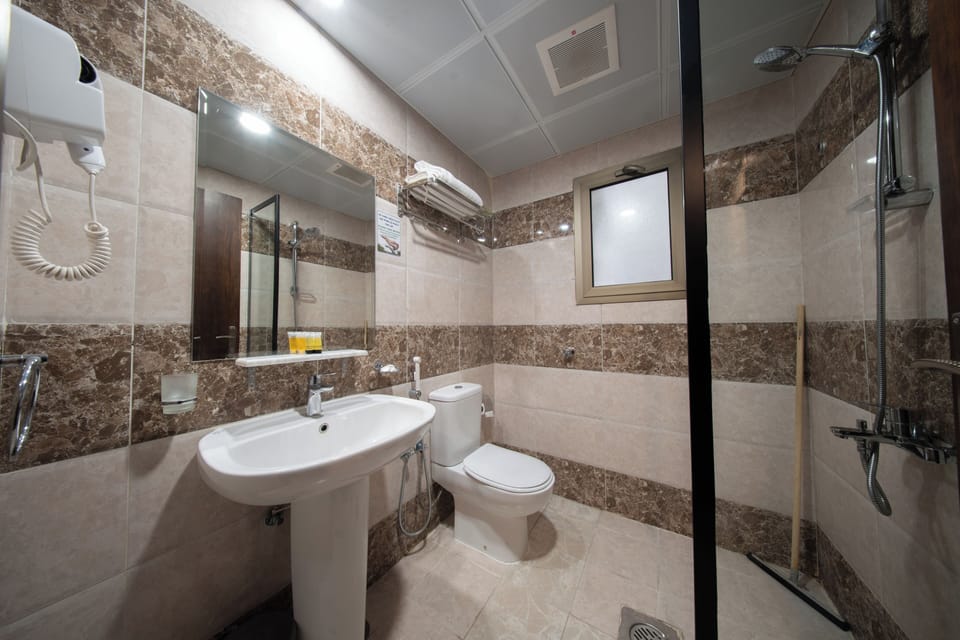Shower, free toiletries, hair dryer, slippers