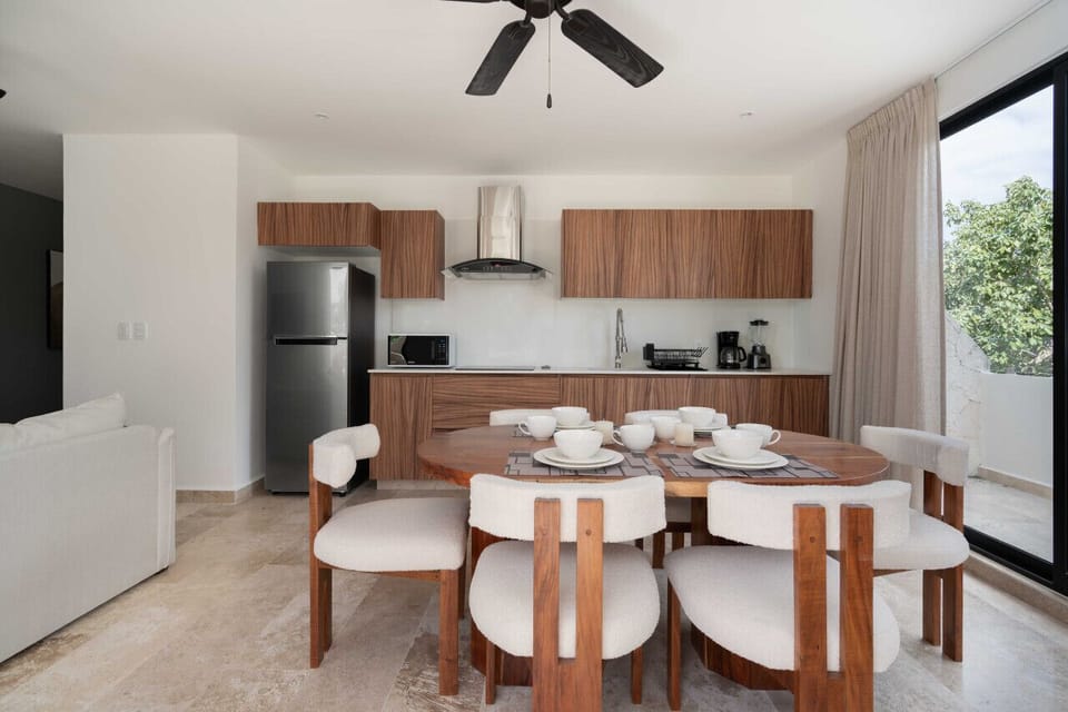 Discover the joy of cooking and dining in our thoughtfully curated wood-themed kitchen and dining space – a feast for the senses