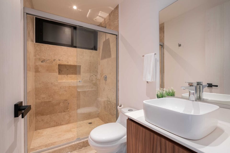 Pamper yourself in our luxurious bathroom oasis, where relaxation meets indulgence