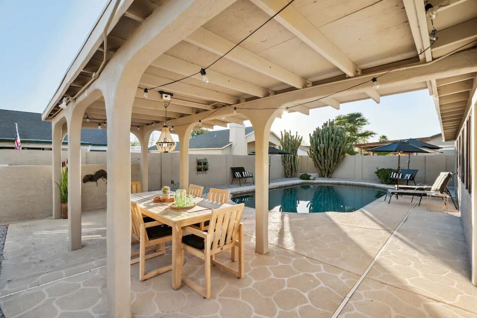 Outdoor dining table. Great space to watch the sunset over the pool. 