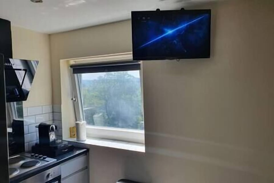 Smart TV in Kitchen/Dining area as well