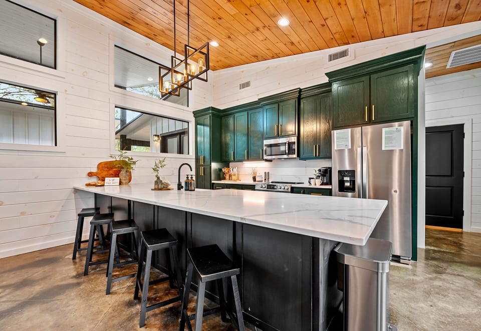 Gather around for great conversation and delicious meals in this spacious kitchen, complete with a modern touch.