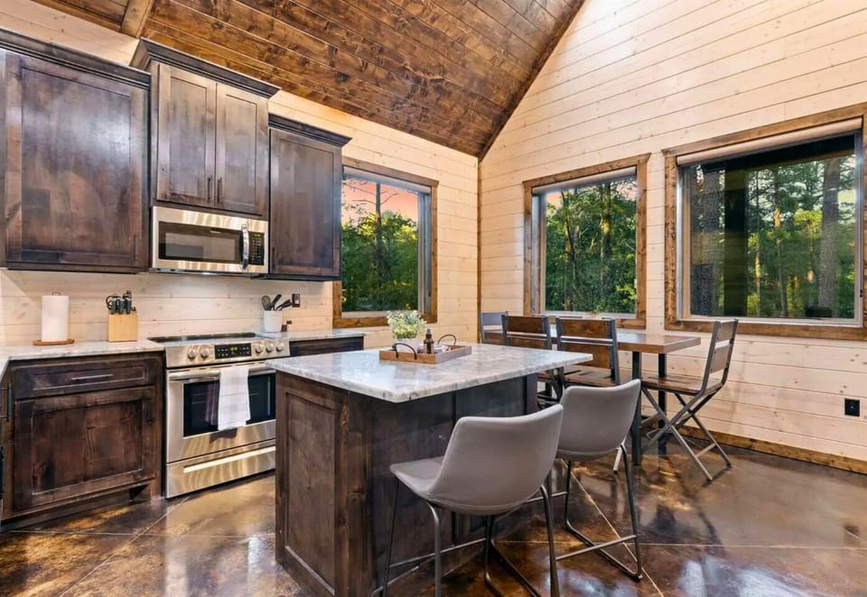 Bright and airy—start your morning with breakfast in this sunlit kitchen.