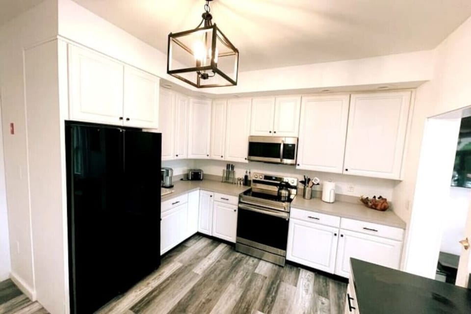 Large Kitchen with new appliances and stone countertop