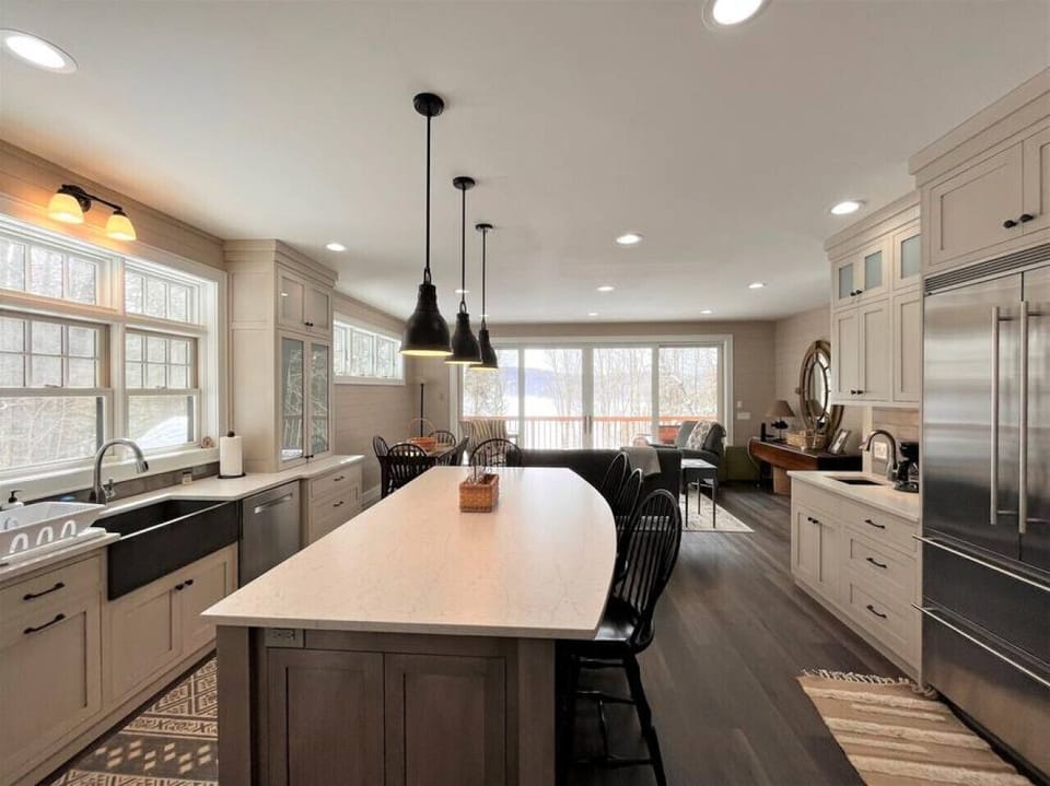 Entire home is open with large windows and doors providing amazing views of the lake.
