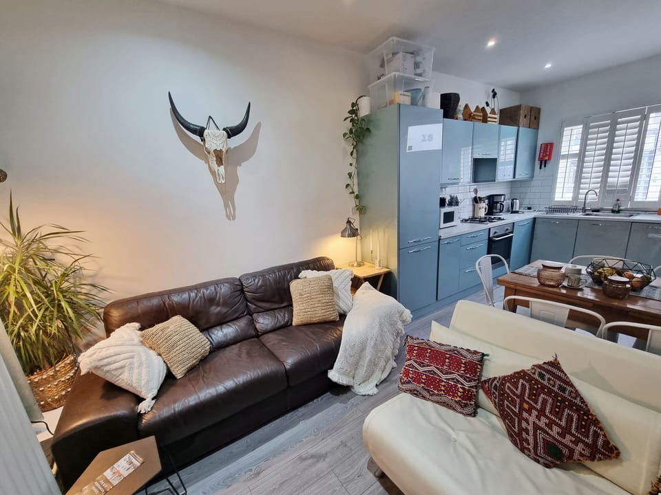 Family Apartment | Living area | 50-inch Smart TV with satellite channels