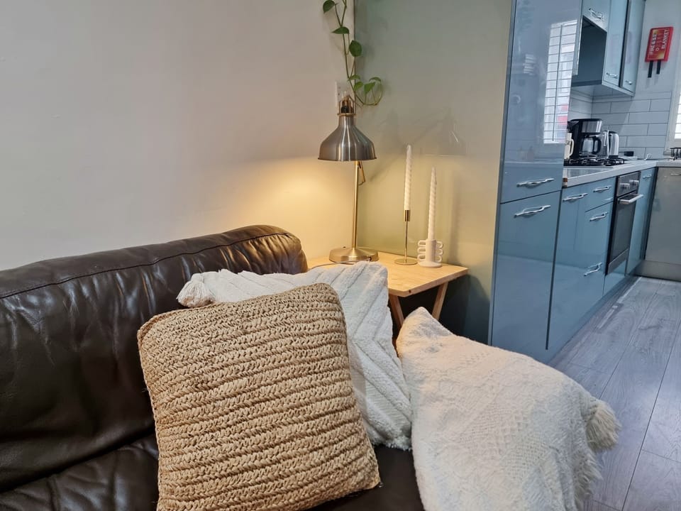 Family Apartment | Living area | 50-inch Smart TV with satellite channels