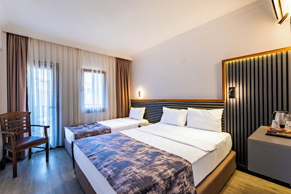 Standard Room, Garden View | Minibar, in-room safe, free WiFi, bed sheets