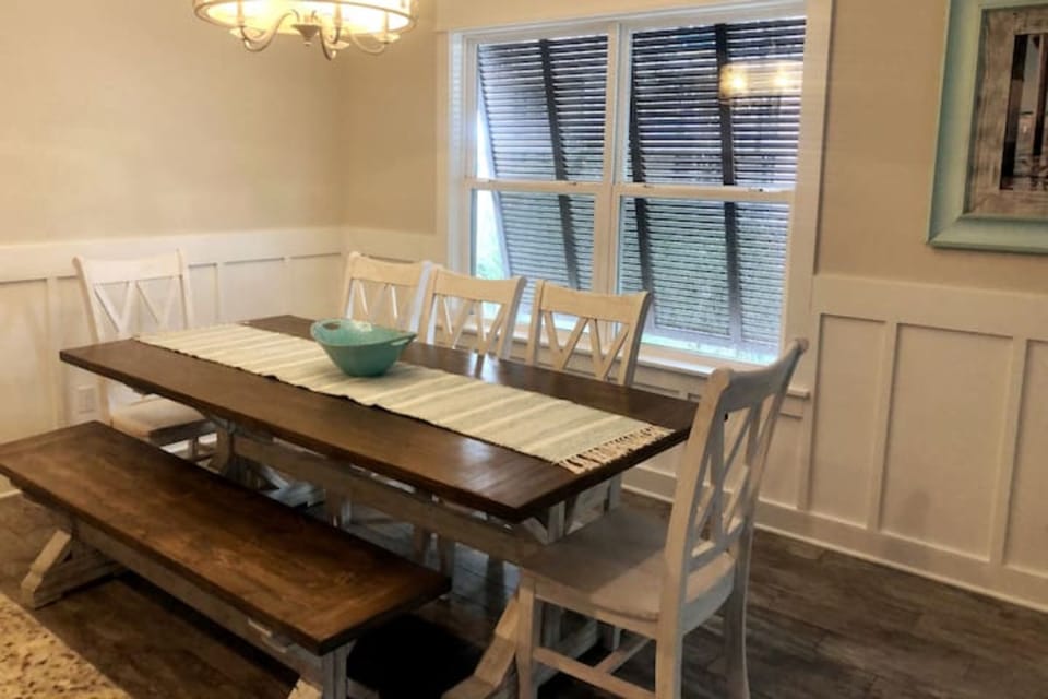 Dining table that seats eight comfortably. Breakfast bar seats four.