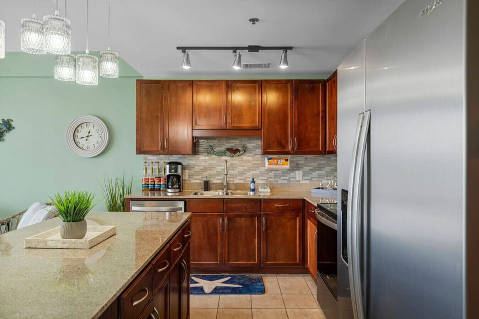 Fully Stocked Kitchen with Ocean Views, Island Bar Seating, Stainless Steel Appliances and Drip Coffee Maker