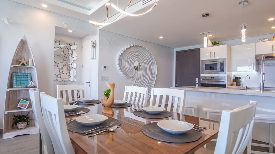 The kitchen and dining table are close together.