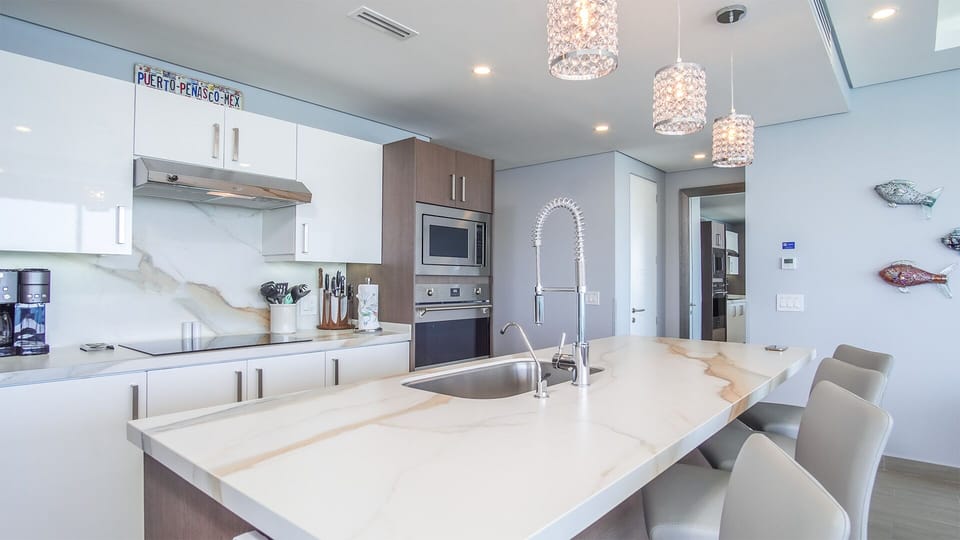 Large kitchen area with bar stools