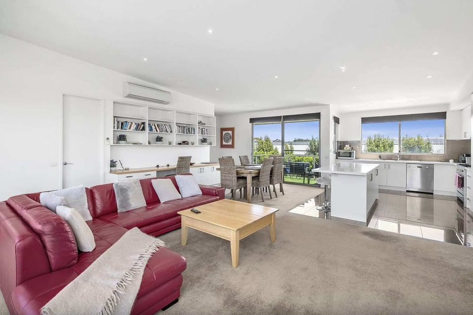 The open plan design provides comfortable lounges with a TV and gas log fire