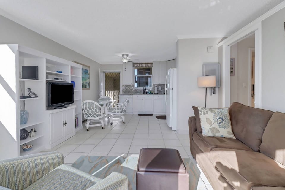 The living space transitions easily to the dining area and full kitchen.