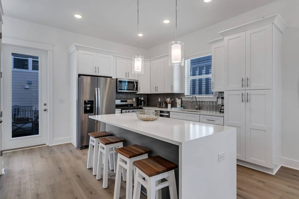 Well appointed open concept kitchen and dining area with seating for 12