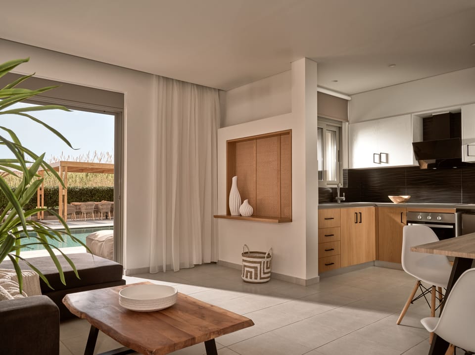 Each suite features an open plan Living Room & Kitchen area with a dining table.