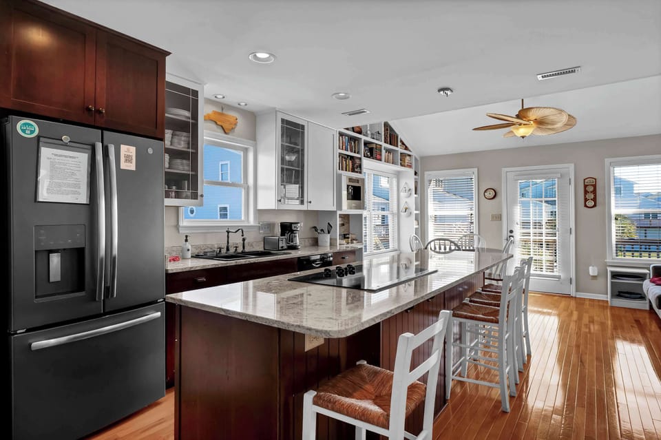 Enjoy casual dining or a morning coffee at the kitchen bar, a perfect spot to fuel up.