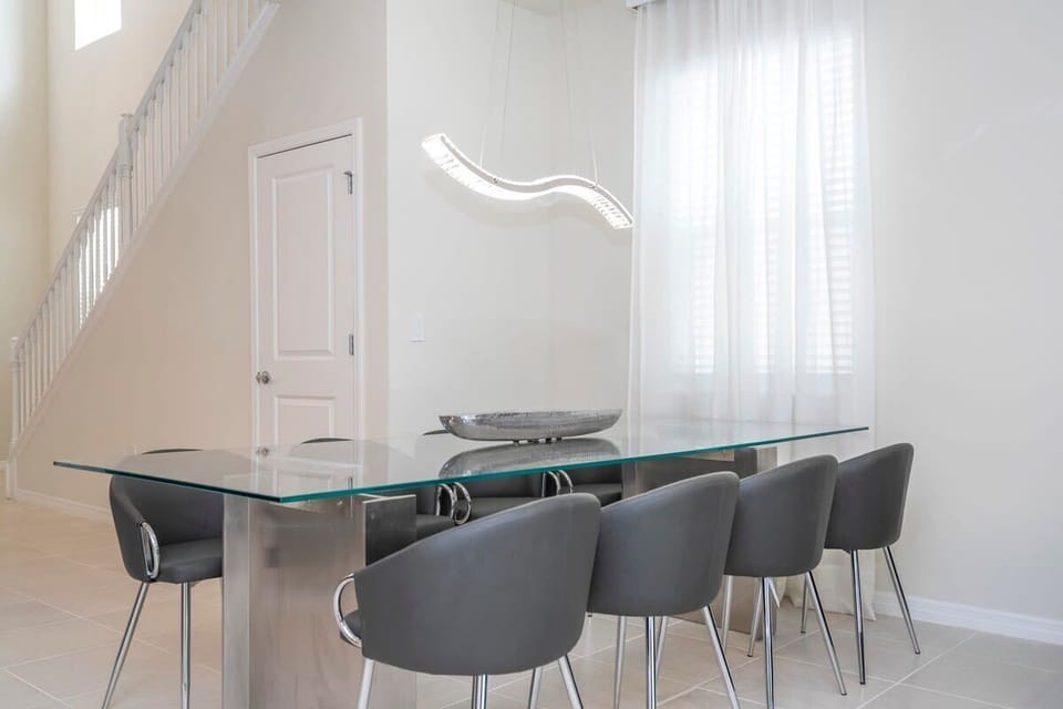 Glass dining table with seating for the group