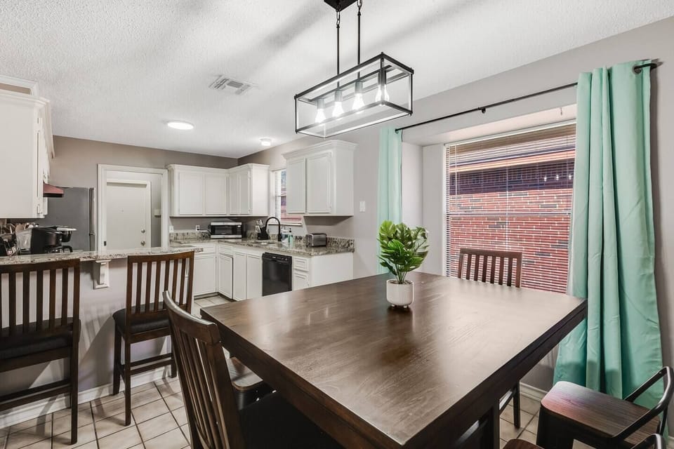 Dine in style at this elegant dining table with seating for all your guests.