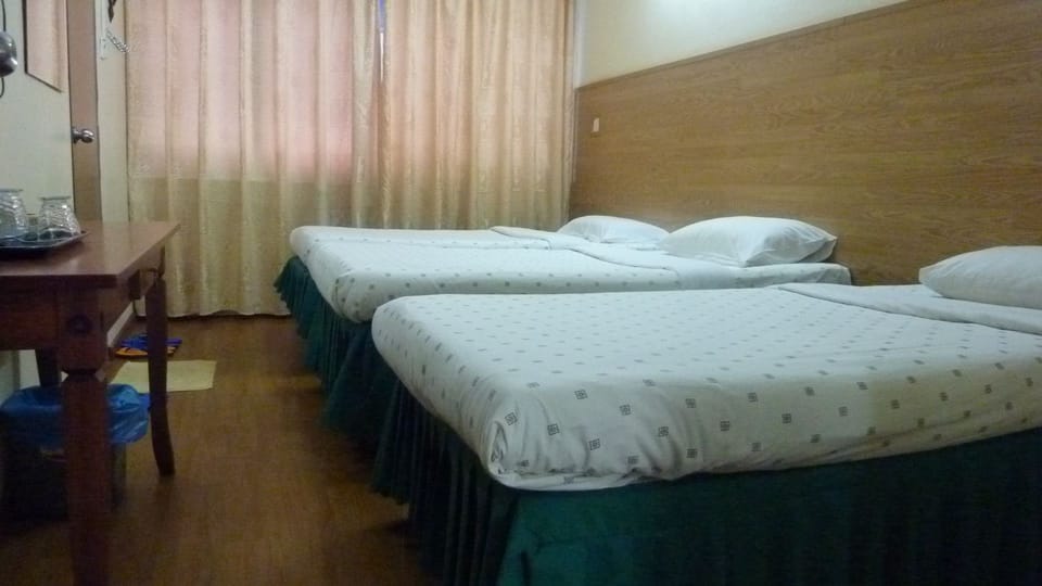 Family Room, 2 Queen Beds | Desk, blackout drapes, iron/ironing board, free WiFi