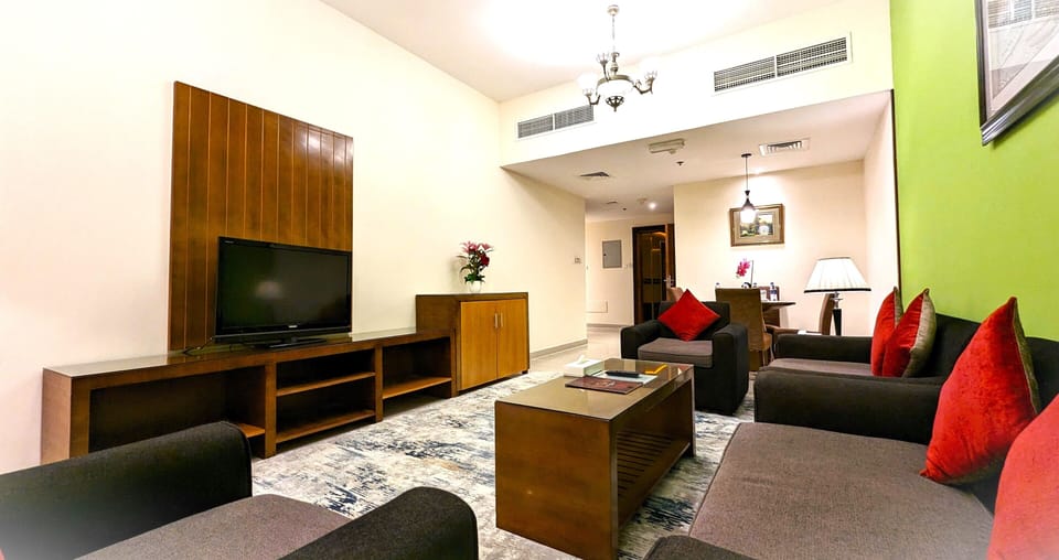 Family Suite, 2 Bedrooms, Kitchen | Living area | 50-inch LED TV with cable channels
