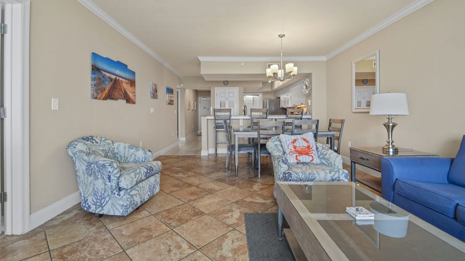 The living room offers ample, comfortable seating, a large flat screen television, and incredible views of the Gulf of Mexico.