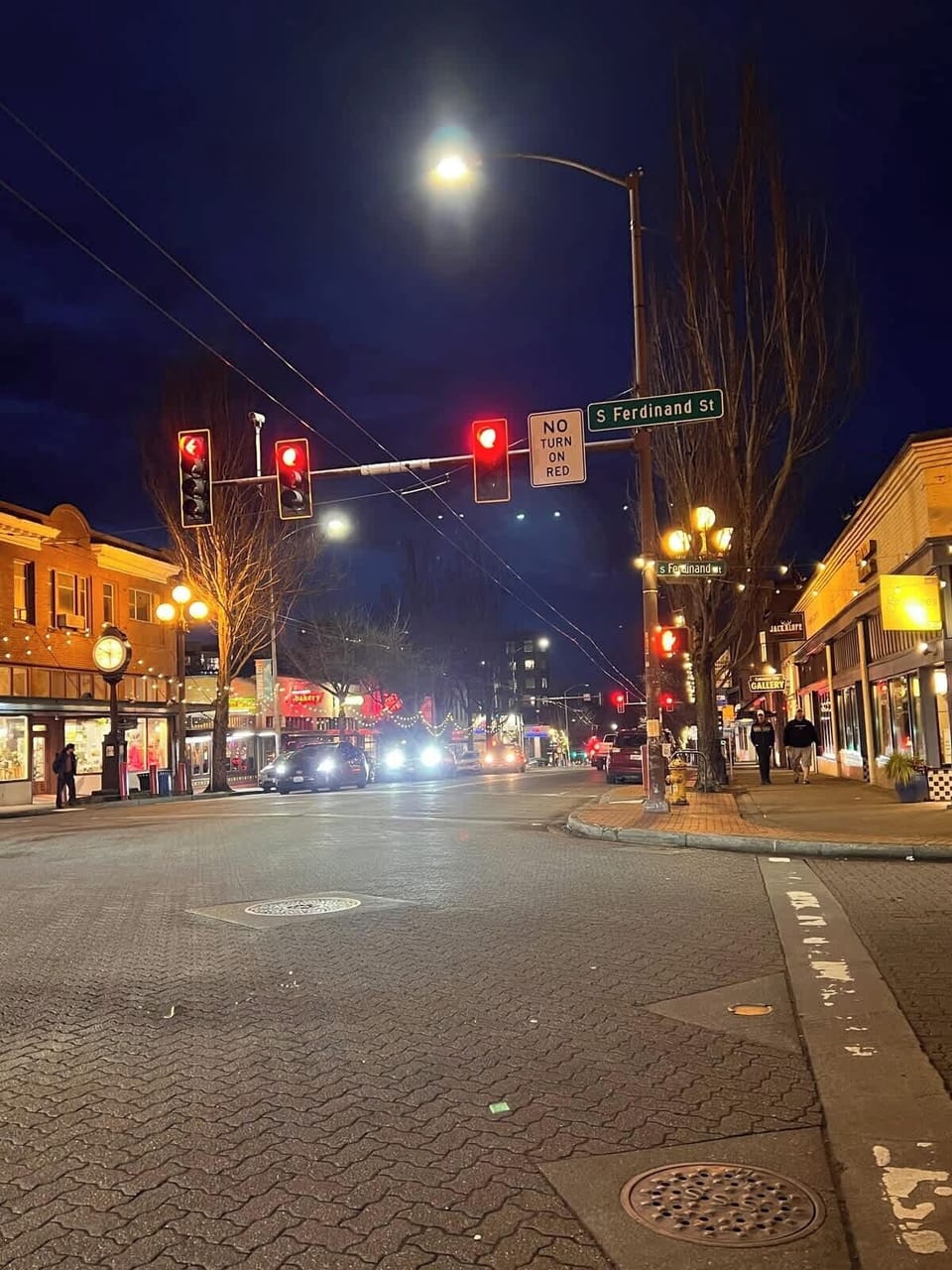 Lively nighttime street with glowing lights, nearby shops and dining, and vibrant city energy just steps away.