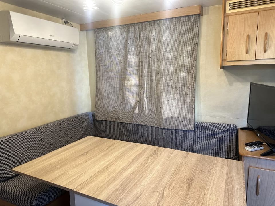 Economy Mobile Home, Non Smoking, Private Bathroom | Living area | 32-inch TV with satellite channels