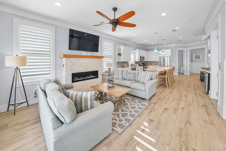 Living room up on the third floor with flat screen tv and fire place.