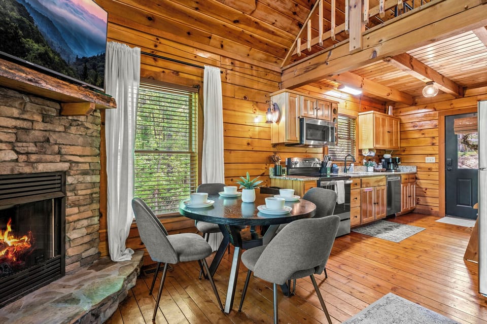 Settle in for a family meal by the fireplace at the 4-person dining table.