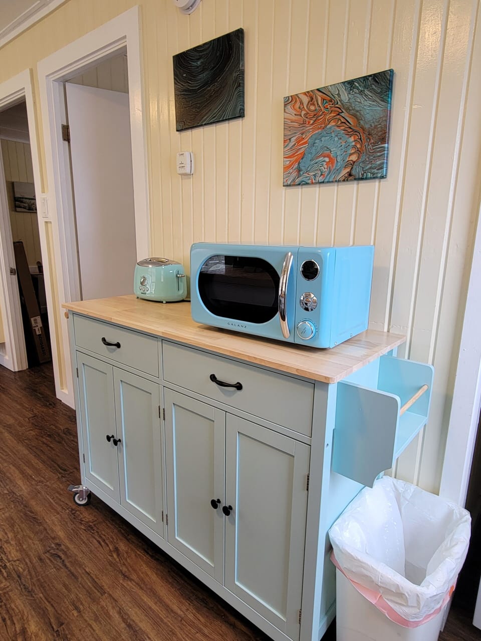 The kitchen cart provides additional storage.