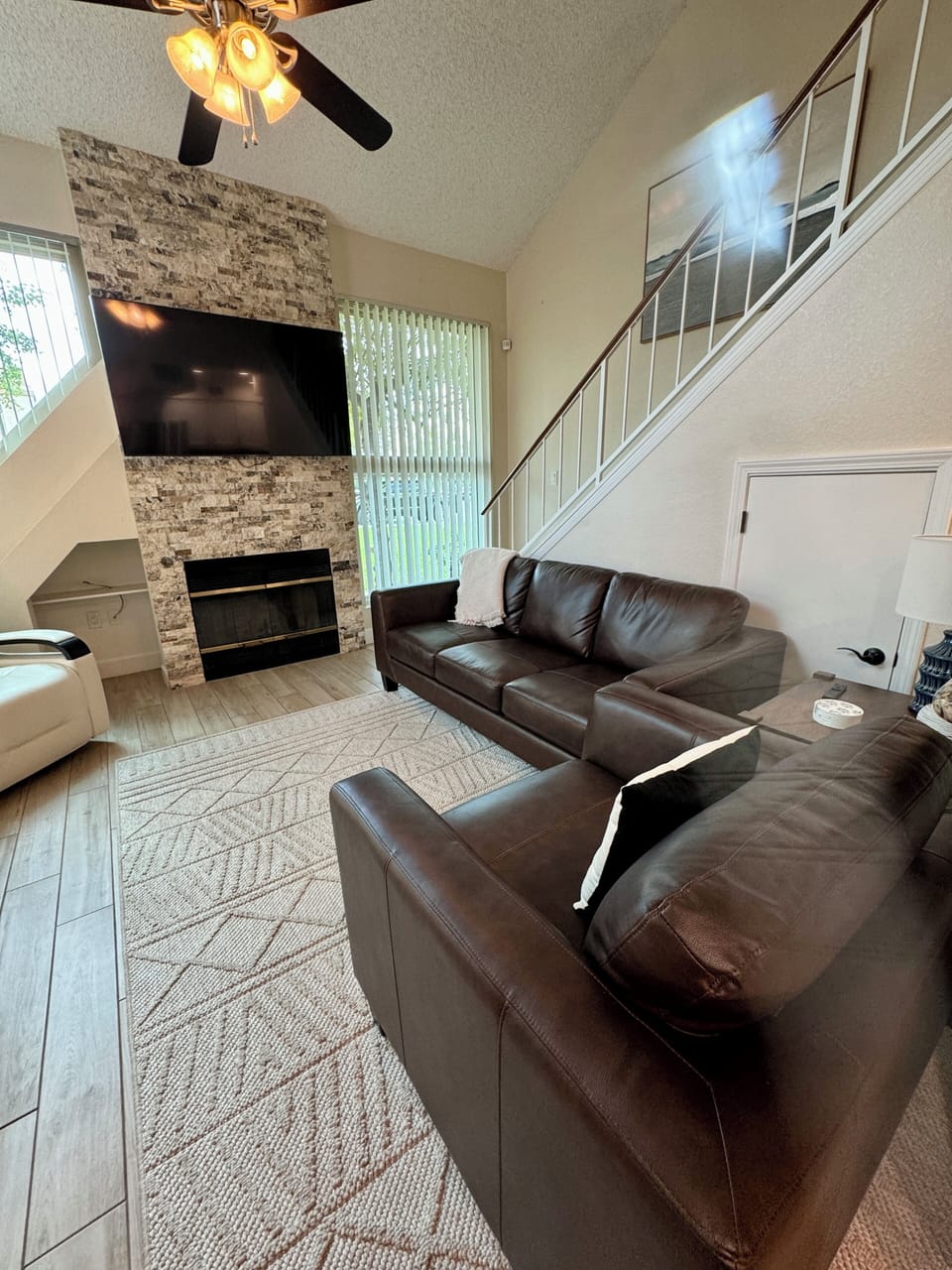 Living Room with fireplace and 70" Smart TV