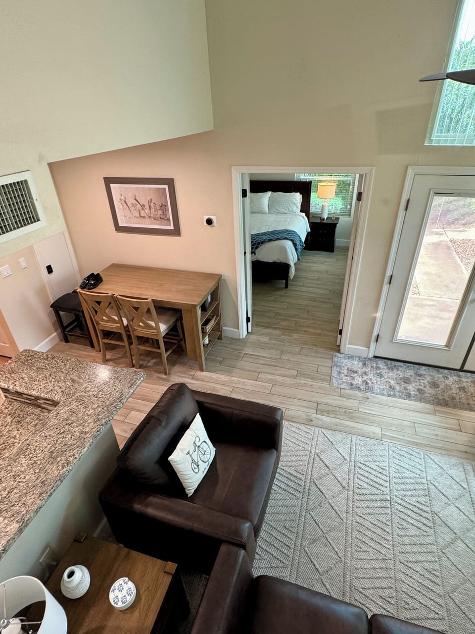 Looking from staircase to Bedroom #1 into eating area and bedroom #3