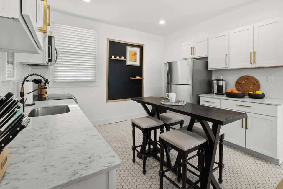 Coffee bar and prep space in bright kitchen.