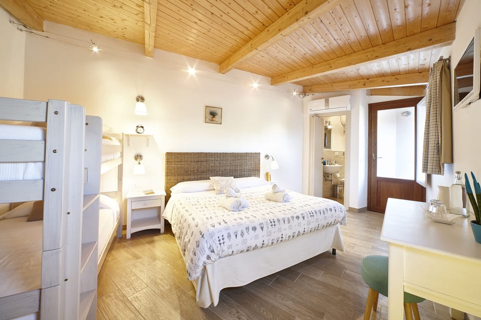 Classic Quadruple Room, 1 Bedroom | Minibar, desk, soundproofing, free WiFi