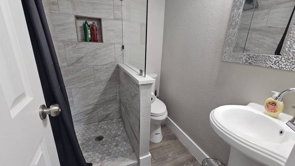 The bathroom is designed to provide guests with a comfortable and relaxing experience.