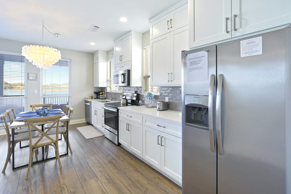 Renovated kitchen is fully stocked with cooking essentials.