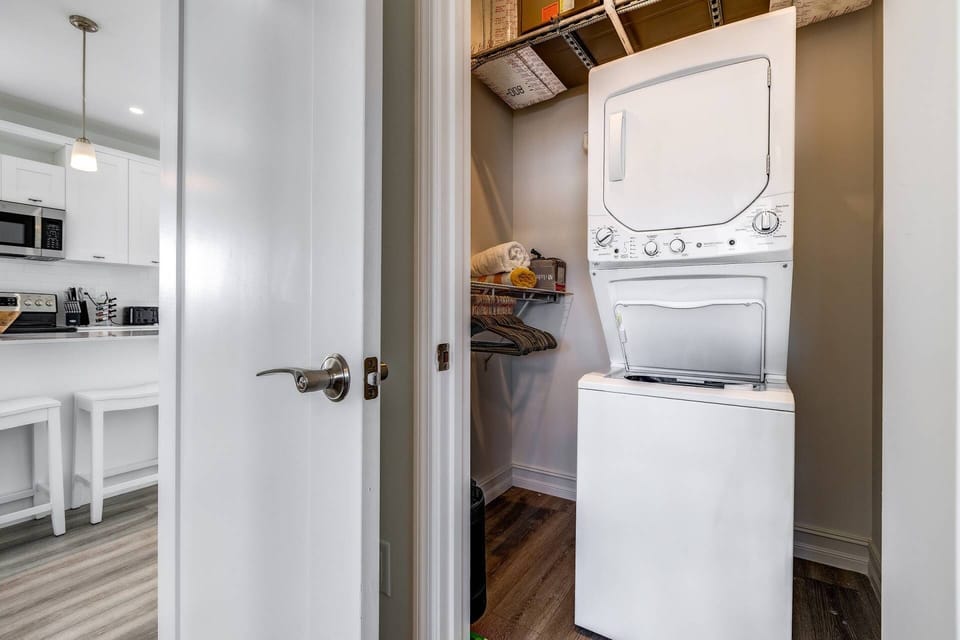 For your convenience, the laundry facilities are discreetly tucked away in the closet of bedroom 2, providing easy access and efficient use of space.
