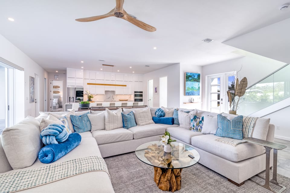 Relax in the heart of the home, where the open living room flows seamlessly into the kitchen.