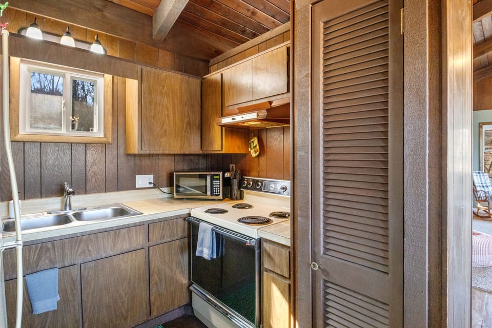 Step into this neatly designed kitchen with all the essentials you need.